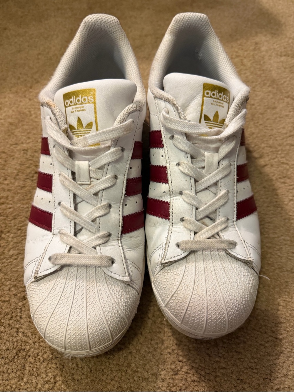 Women’s US 7 Adidas Superstar shell-toe sneakers. White w/Burgundy Stripes. Used